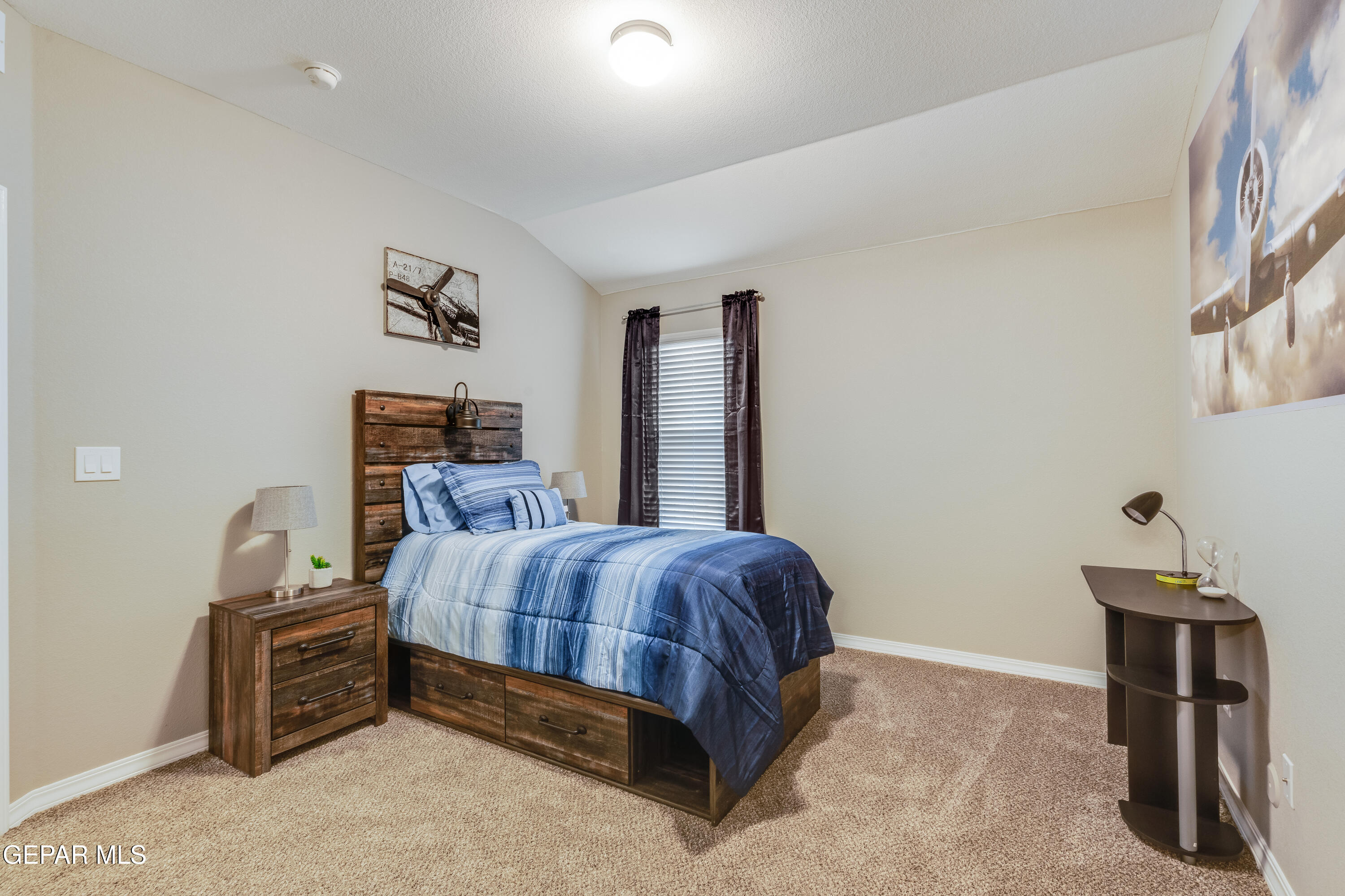512 Caddo Lane Clint, TX 79836 - Photo 34 of 38 a bedroom with a bed and a table in it