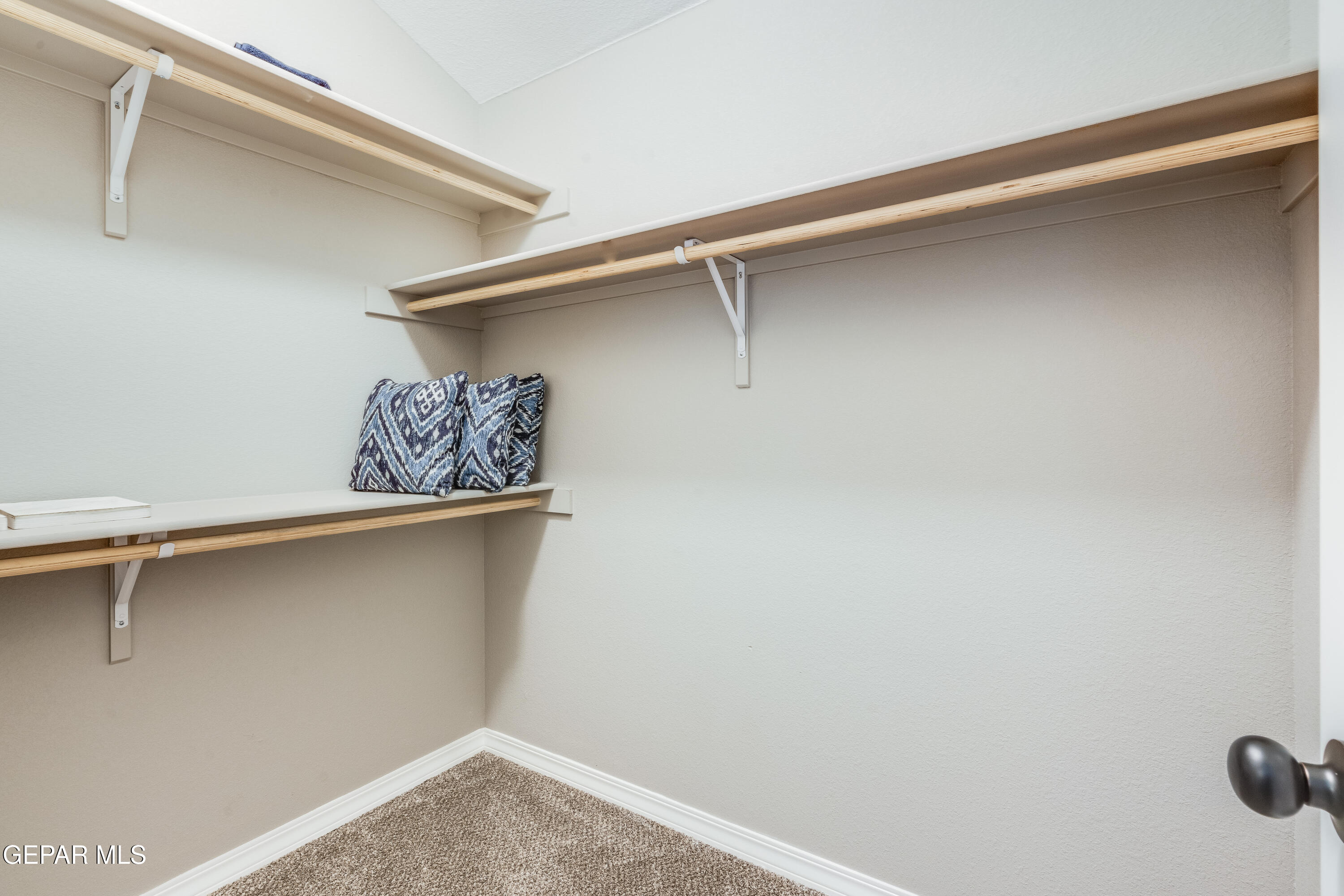 512 Caddo Lane Clint, TX 79836 - Photo 7 of 38 a view of a room with rack on the wall