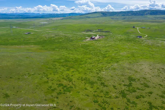 a view of a golf course with a yard