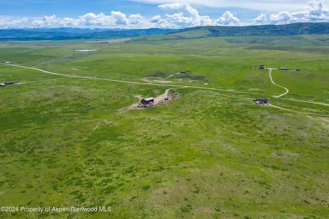 a view of a field with an ocean