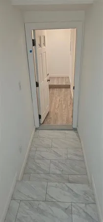 a kitchen with a stove sink and cabinets