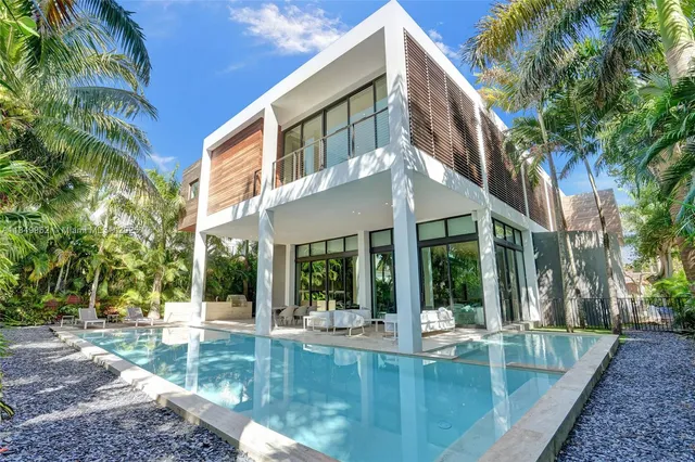 a close view of a stove a sink and dishwasher with wooden floor