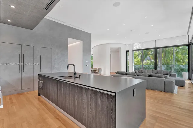 a bedroom with a large bed and a large window