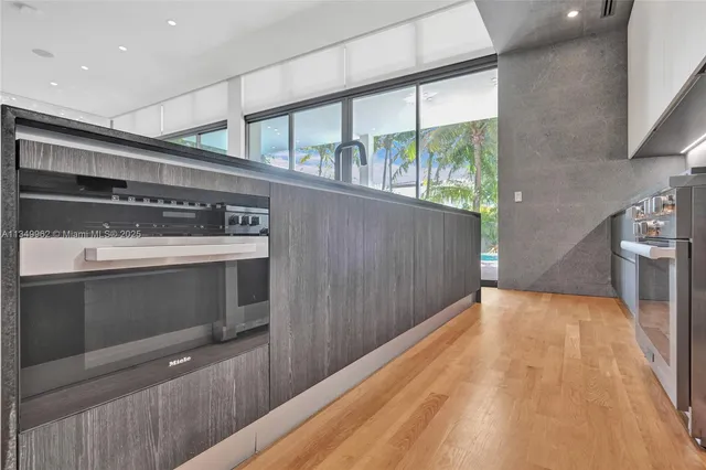 a bedroom with a large bed and a large window