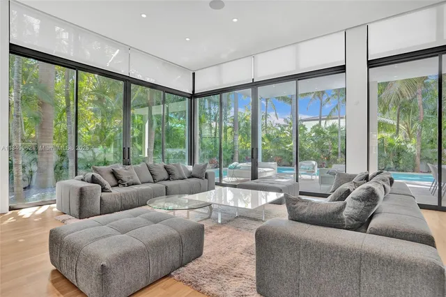 a bedroom with a bed and a wooden floor