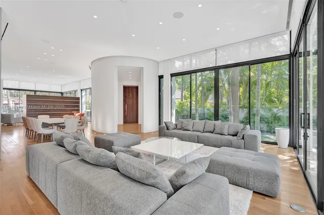 a bathroom with a double vanity sink mirror and bathtub