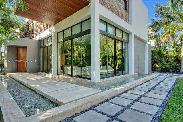 a view of a swimming pool with a yard