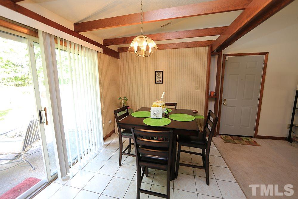 4509 Fox Road Raleigh, NC 27616 - Photo 7 of 13 a view of a dining room with furniture and a window