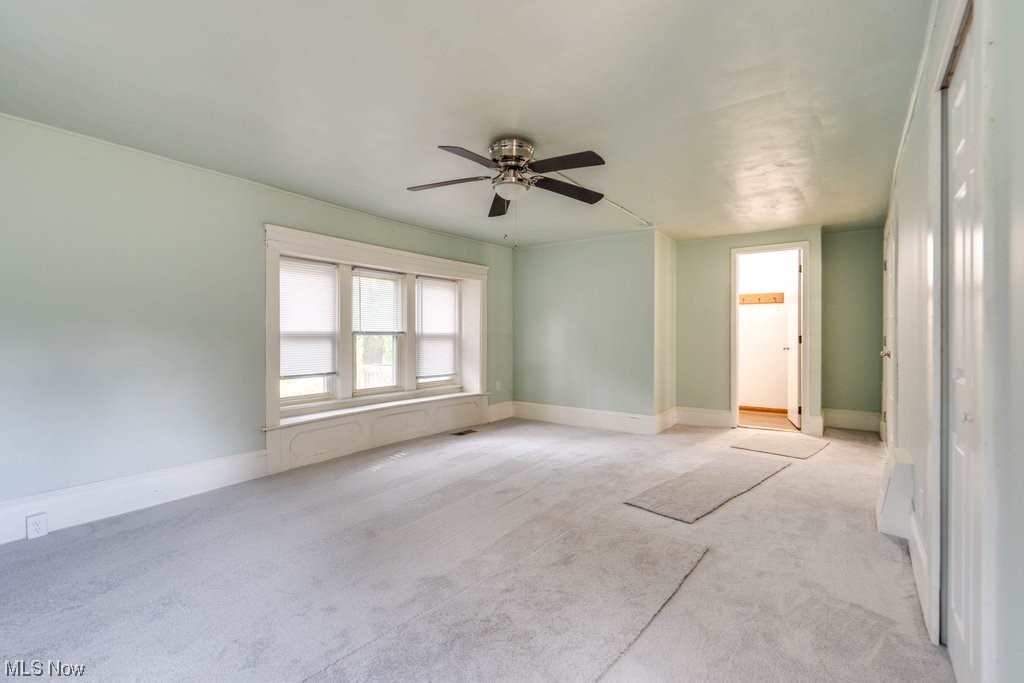 3775 East Waterloo Road Akron, OH 44312 - Photo 17 of 33 Carpeted empty room with ceiling fan