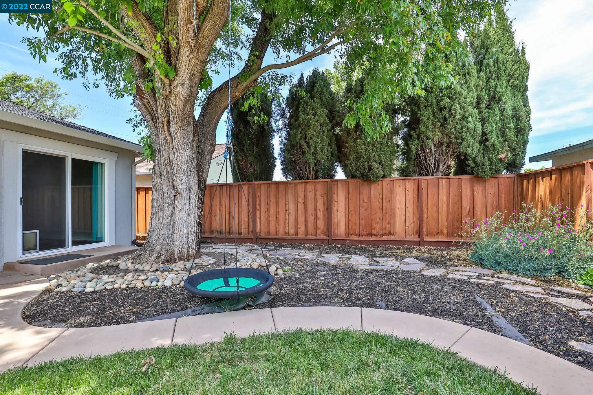 2144 Dena Drive Concord, CA 94519 - Photo 15 of 27 a view of a backyard with tree s