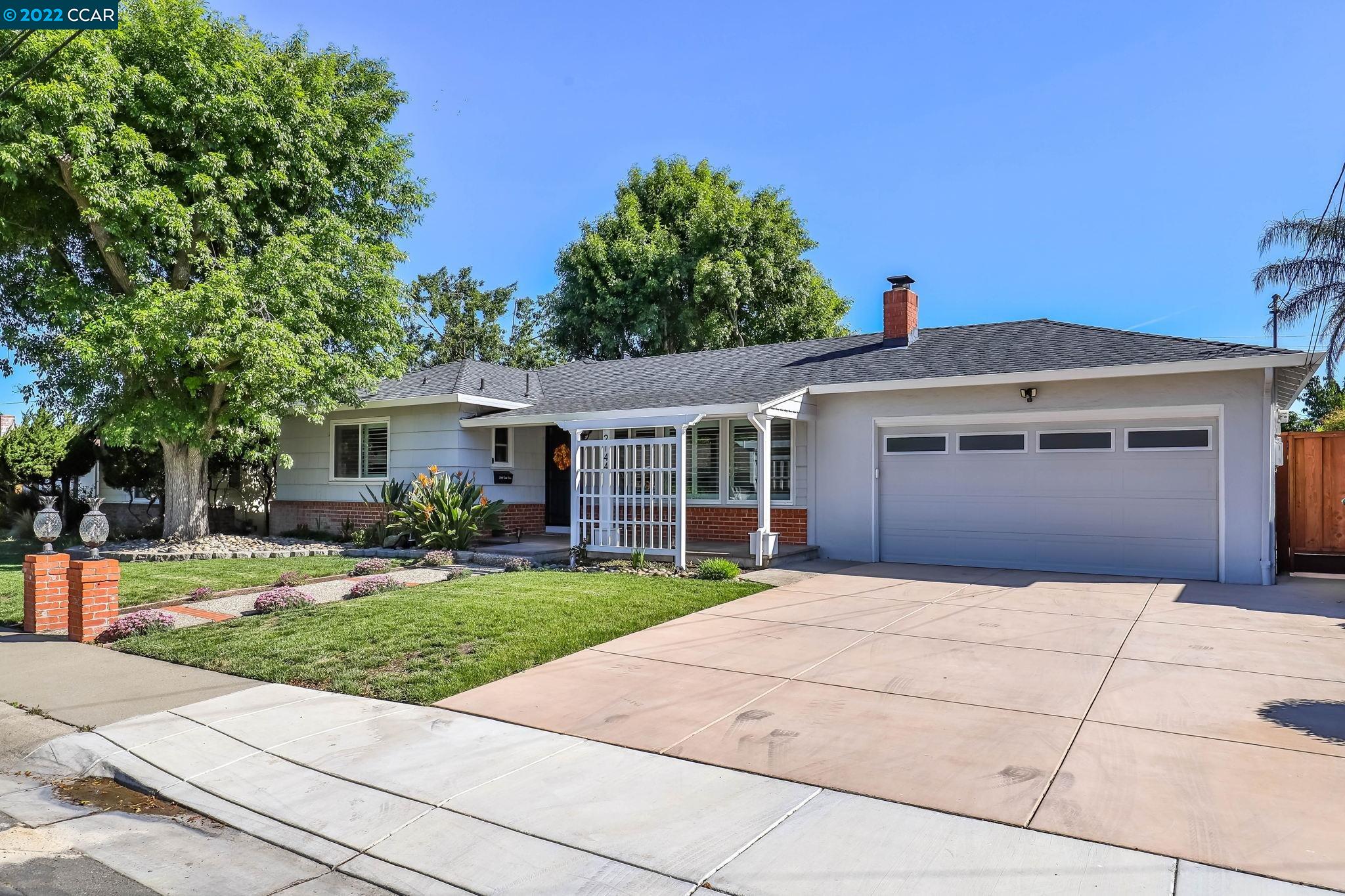 2144 Dena Drive Concord, CA 94519 - Photo 2 of 27 a front view of a house with a yard and potted plants