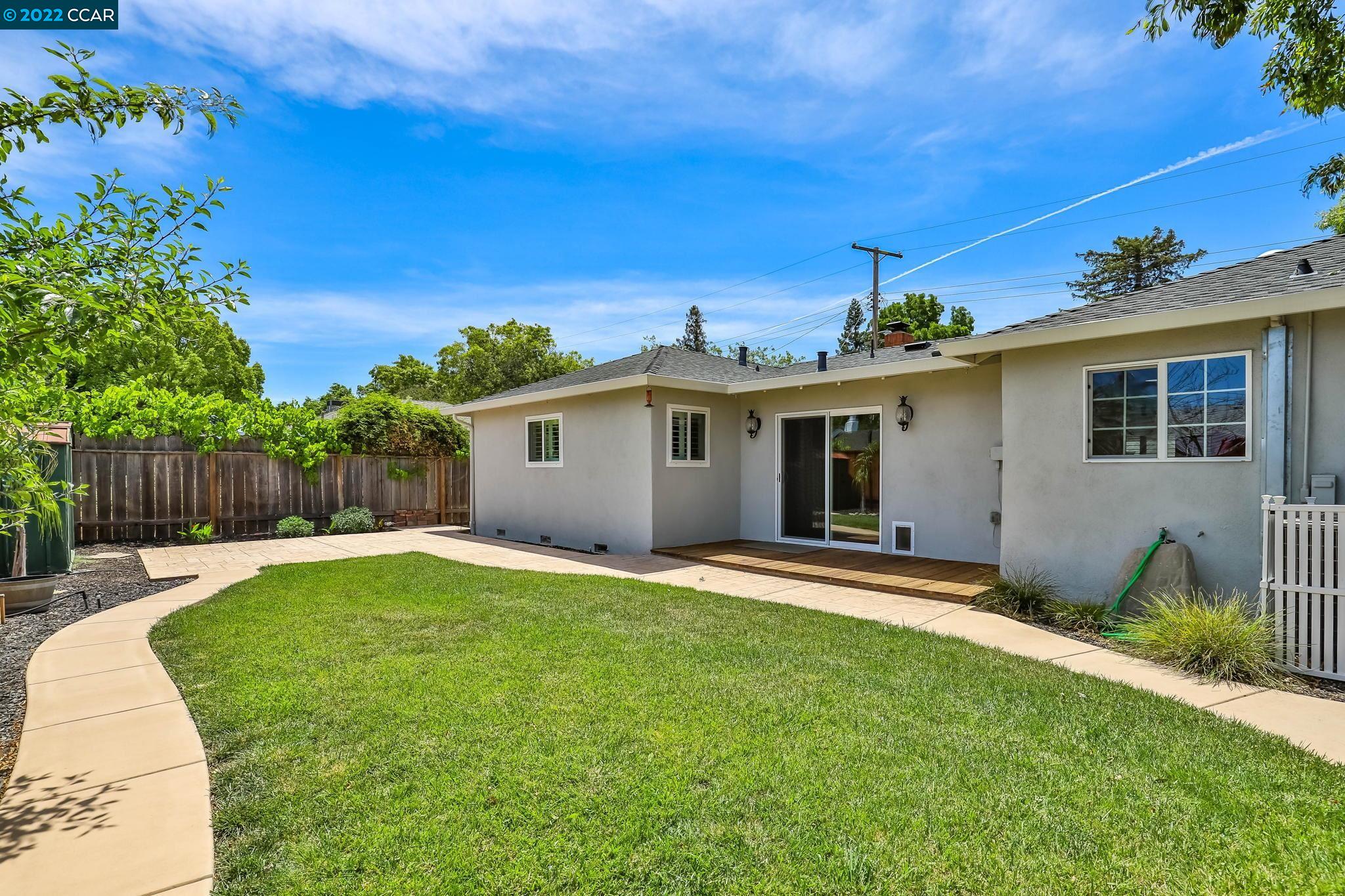 2144 Dena Drive Concord, CA 94519 - Photo 21 of 27 a backyard of a house with table and chairs