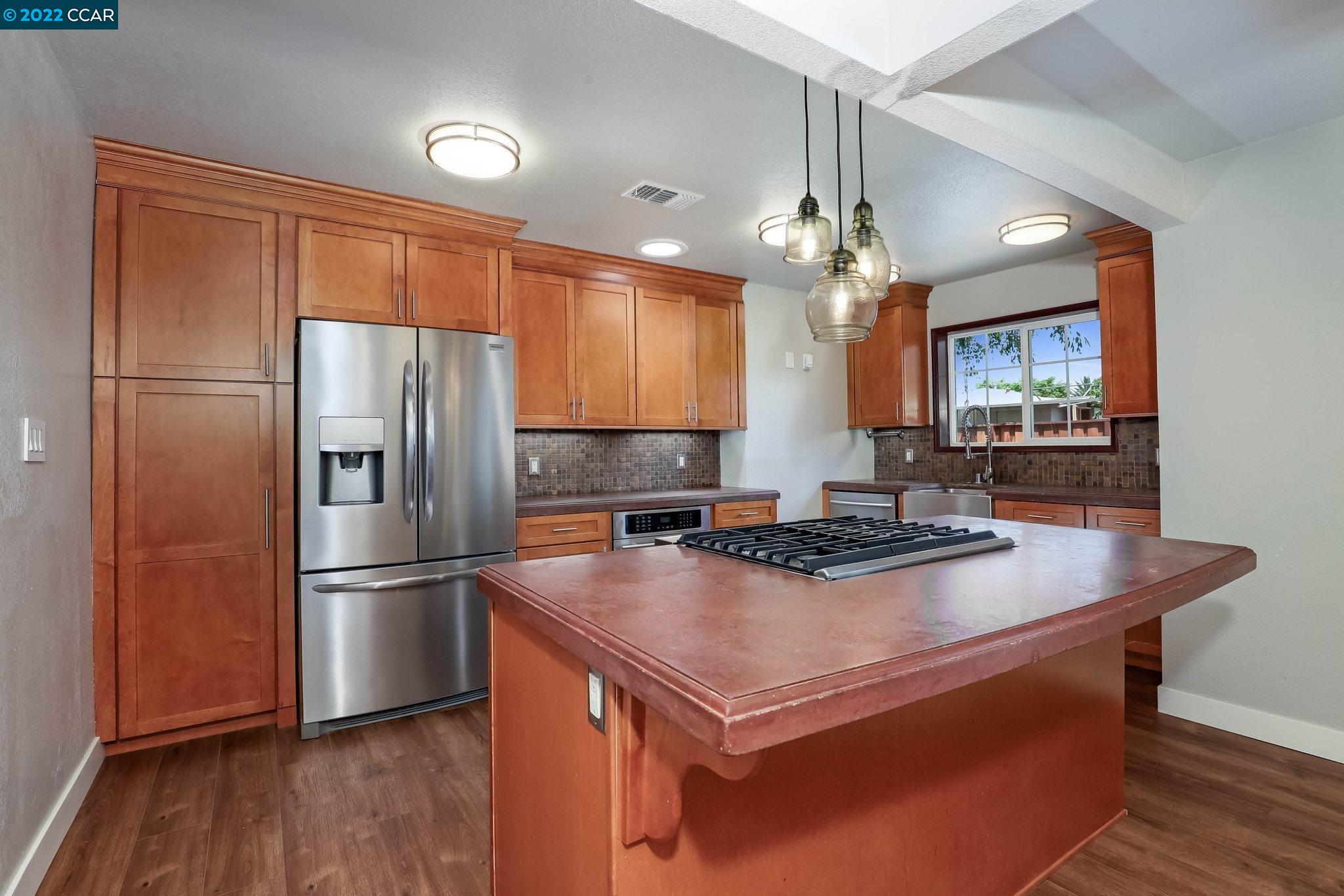 2144 Dena Drive Concord, CA 94519 - Photo 6 of 27 a kitchen with stainless steel appliances granite countertop a refrigerator a stove a sink and a refrigerator