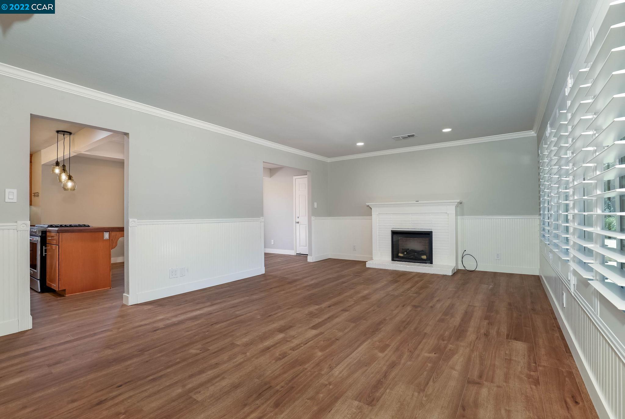 2144 Dena Drive Concord, CA 94519 - Photo 8 of 27 a view of empty room with wooden floor and fireplace