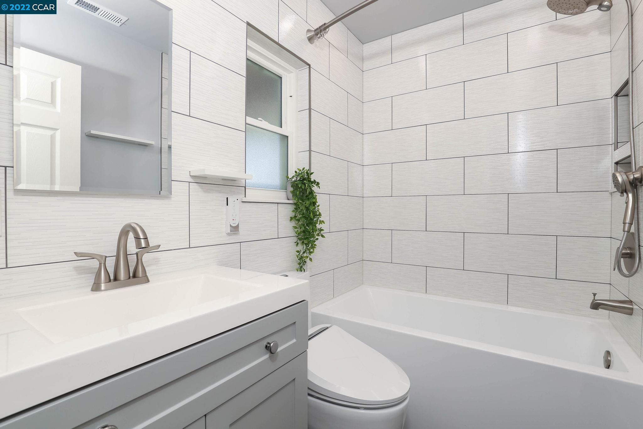 2144 Dena Drive Concord, CA 94519 - Photo 10 of 27 a bathroom with a sink a toilet and bathtub