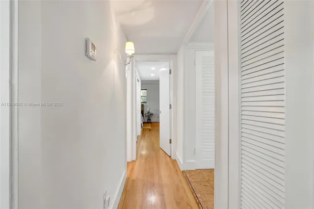 a view of a bathroom from a hallway