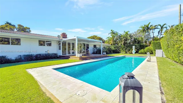 a view of a swimming pool with a patio