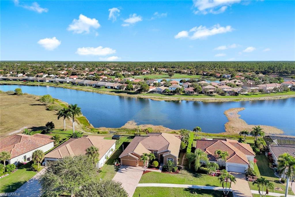 an aerial view of a houses with a lake view