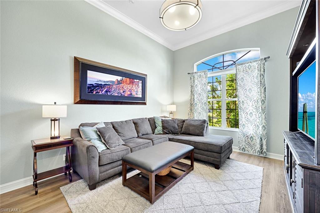 2143 Grove Drive Naples, FL 34120 - Photo 11 of 35 a living room with furniture and a large window