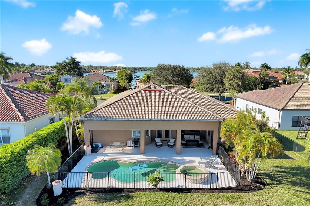 2143 Grove Drive Naples, FL 34120 - Photo 28 of 35 an aerial view of a house with swimming pool garden view and a fountain