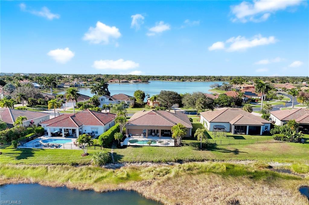 2143 Grove Drive Naples, FL 34120 - Photo 33 of 37 Aerial perspective of suburban area featuring a large body of water and a pool area