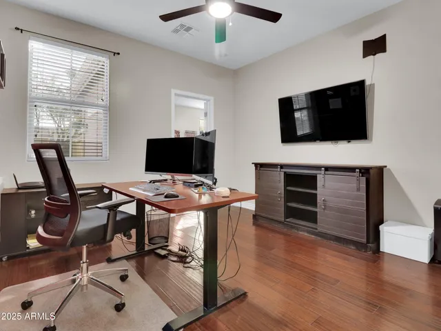 a view of a livingroom with furniture and a flat screen tv