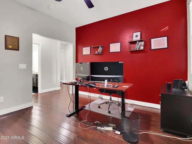 a living room with furniture and a laptop