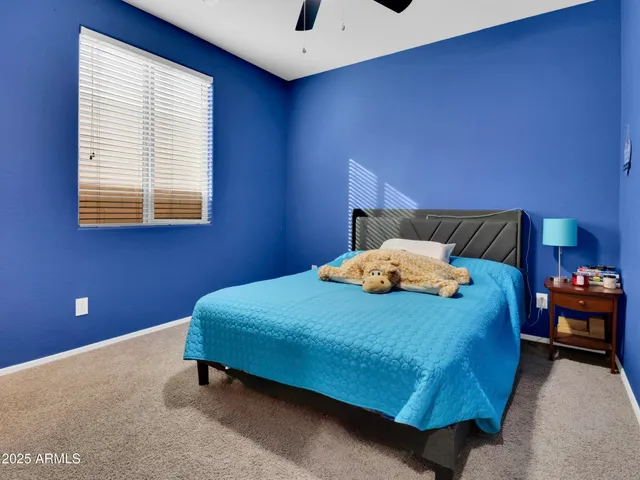 a bedroom with a bed and window