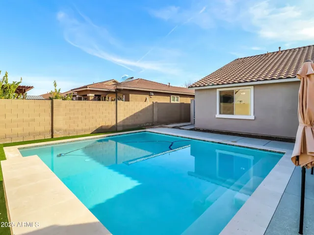 a view of a balcony with floor to ceiling windows