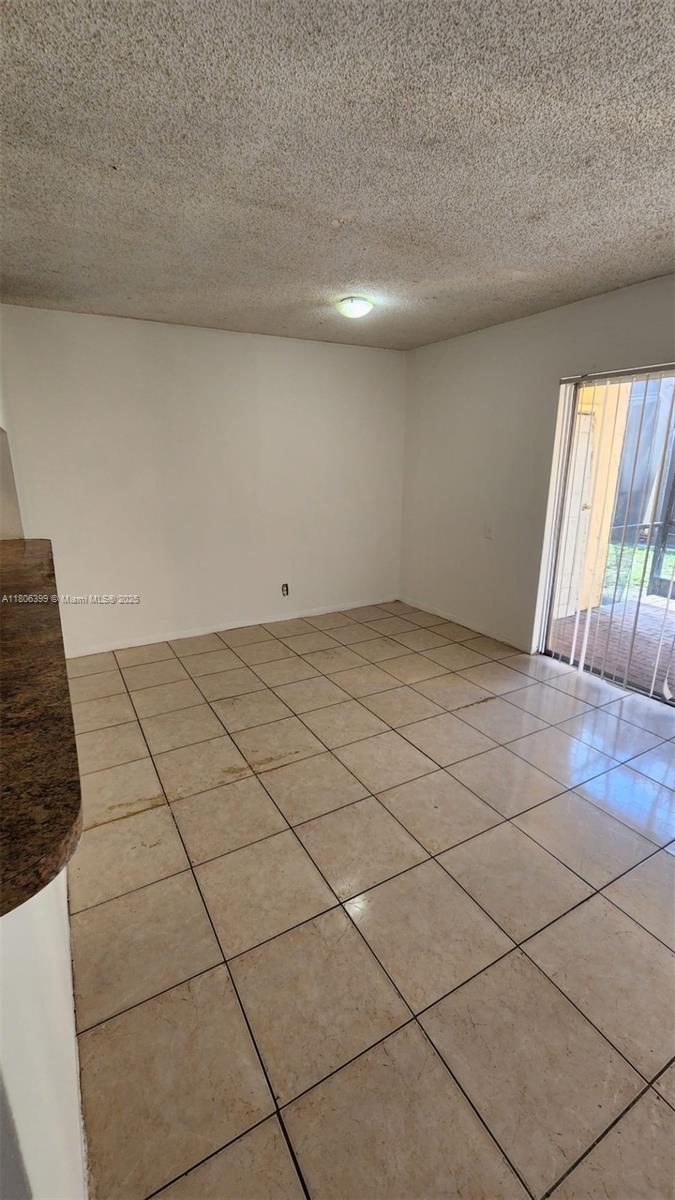 4425 Treehouse Lane, Unit B Tamarac, FL 33319 - Photo 17 of 19 a view of an empty room and window