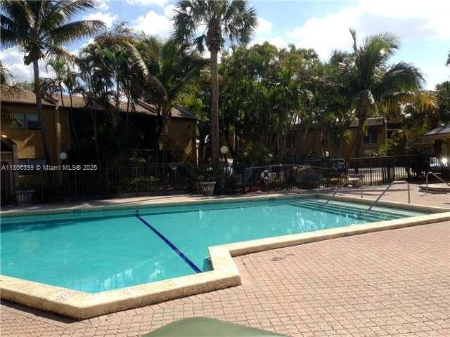 4425 Treehouse Lane, Unit B Tamarac, FL 33319 - Photo 6 of 19 a view of a tennis court