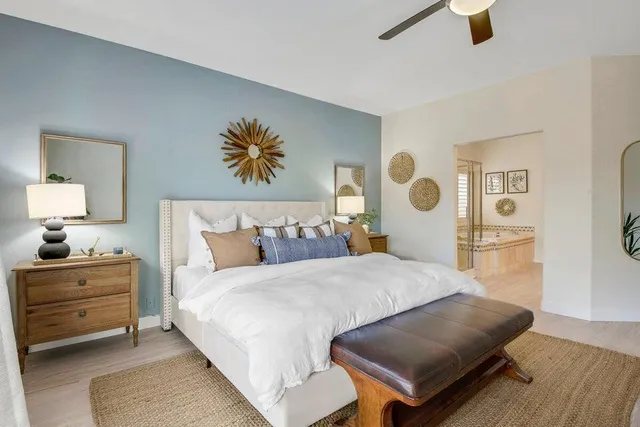 a bedroom with a bed and dresser