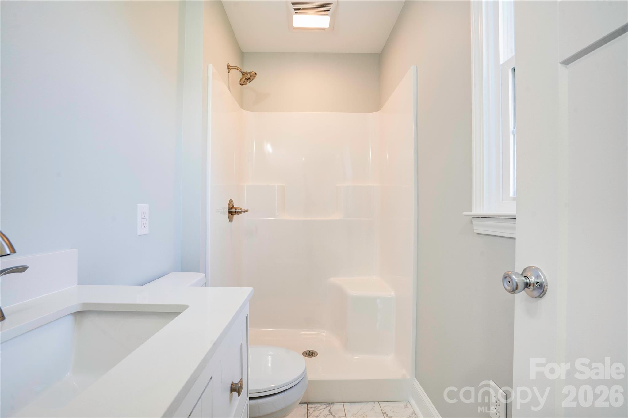 2822 Bettis Road Grover, NC 28073 - Photo 15 of 32 a bathroom with a sink a toilet and shower