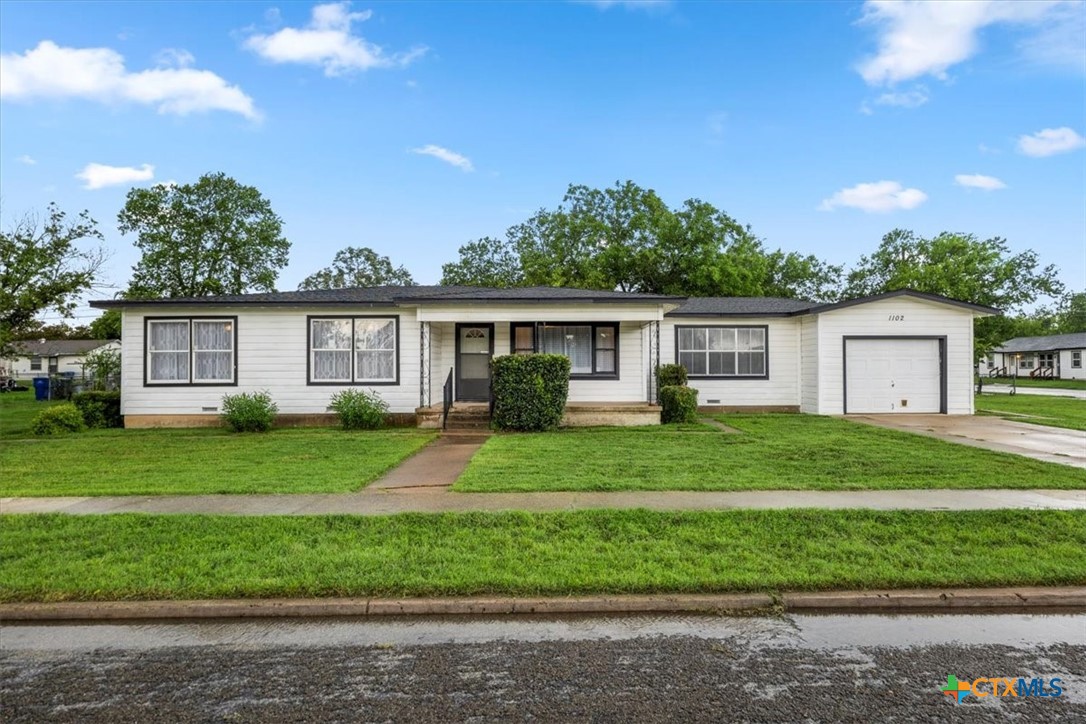 1102 South 5th Street Copperas Cove, TX 76522 - Photo 2 of 40 a front view of a house with a garden
