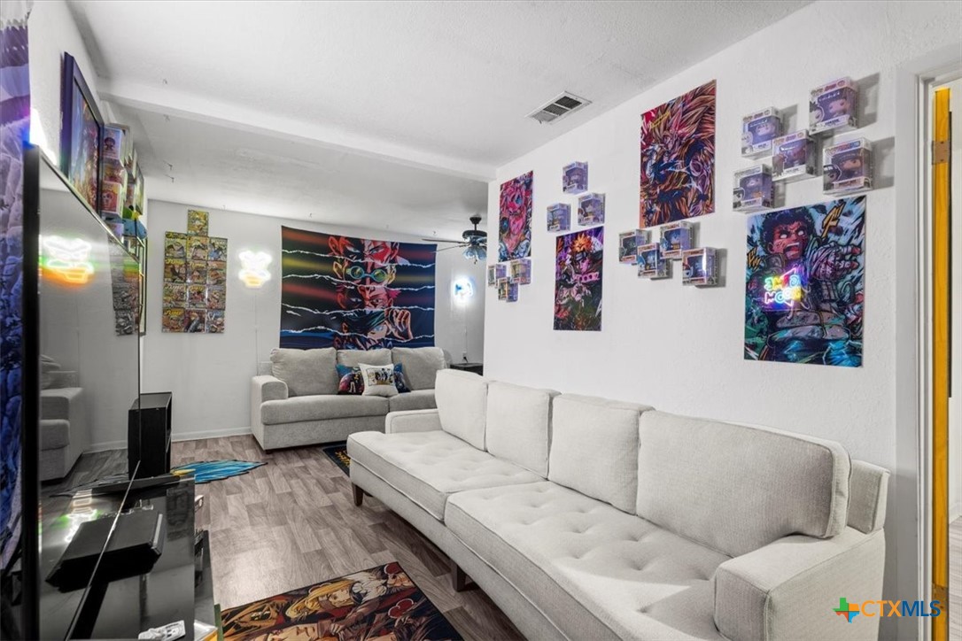 1102 South 5th Street Copperas Cove, TX 76522 - Photo 22 of 40 a living room with furniture and a flat screen tv