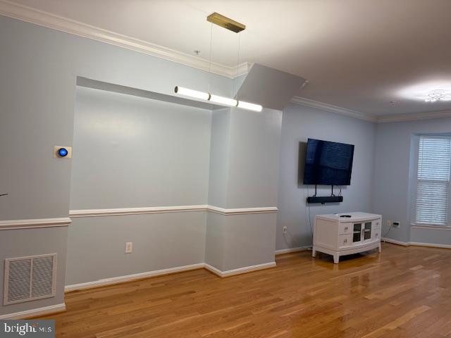 11777 Skylark Road Clarksburg, MD 20871 - Photo 13 of 75 a living room with a flat screen tv on dresser and a wooden floor