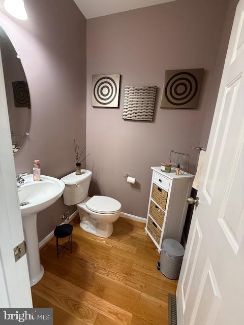 11777 Skylark Road Clarksburg, MD 20871 - Photo 28 of 75 a white toilet sitting next to a bathroom sink