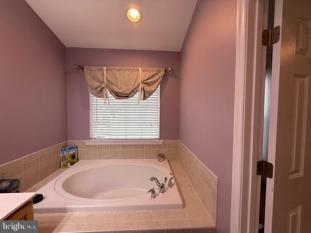 11777 Skylark Road Clarksburg, MD 20871 - Photo 46 of 75 a bath tub sitting in a bathroom next to a window