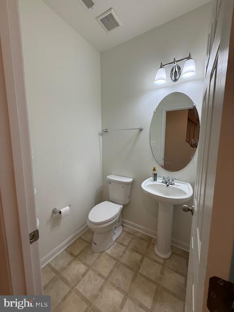 11777 Skylark Road Clarksburg, MD 20871 - Photo 70 of 75 a bathroom with a toilet sink and mirror