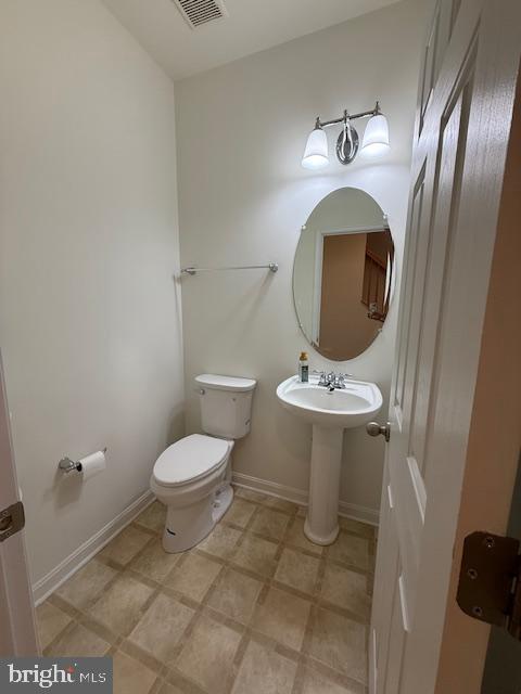 11777 Skylark Road Clarksburg, MD 20871 - Photo 71 of 75 a bathroom with a toilet a sink and a mirror