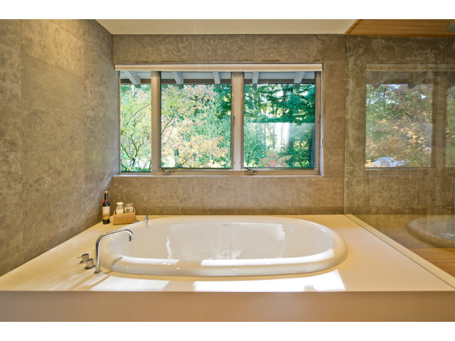 1850 Brookvale Road Hillsborough, CA 94010 - Photo 15 of 24 a white bath tub sitting in a bathroom next to a window
