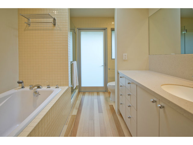 1850 Brookvale Road Hillsborough, CA 94010 - Photo 17 of 24 a spacious bathroom with a tub sink and mirror