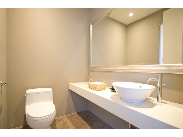 1850 Brookvale Road Hillsborough, CA 94010 - Photo 19 of 24 a bathroom with a sink a toilet and mirror