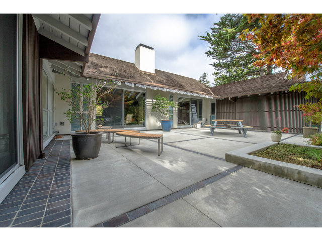 1850 Brookvale Road Hillsborough, CA 94010 - Photo 20 of 24 a view of a patio with table and chairs potted plants and large tree