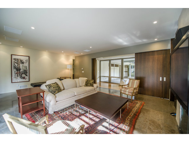 1850 Brookvale Road Hillsborough, CA 94010 - Photo 2 of 24 a living room with furniture a rug and a table