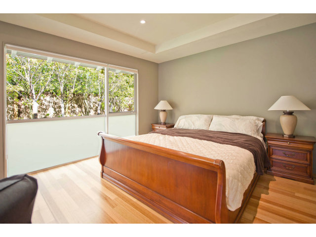 1850 Brookvale Road Hillsborough, CA 94010 - Photo 9 of 24 a bedroom with a bed and a large window