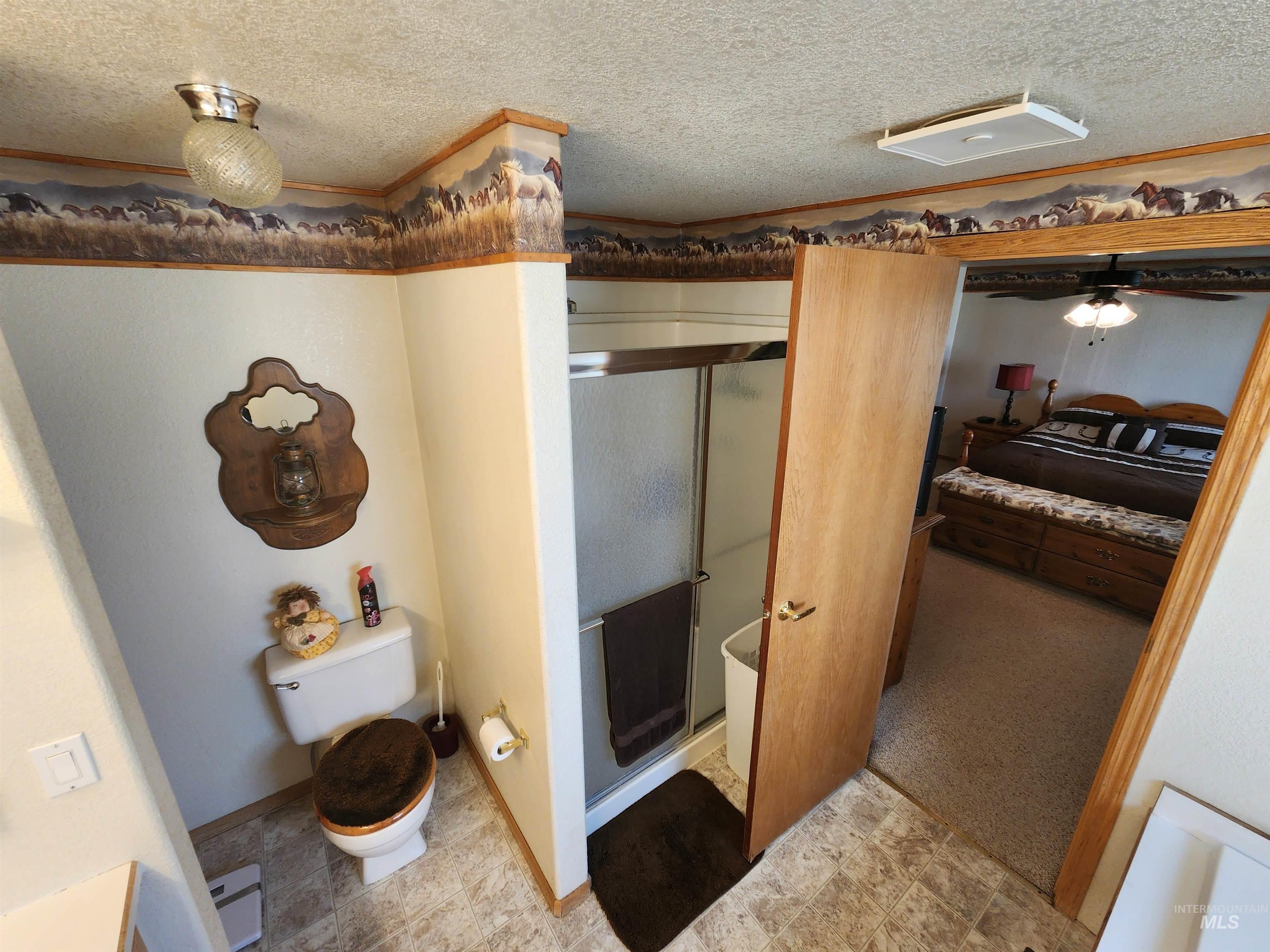 7001 South Robinson Road Melba, ID 83641 - Photo 8 of 38 Dual vanity with integrated sinks, framed mirror, and Hollywood-style lighting
