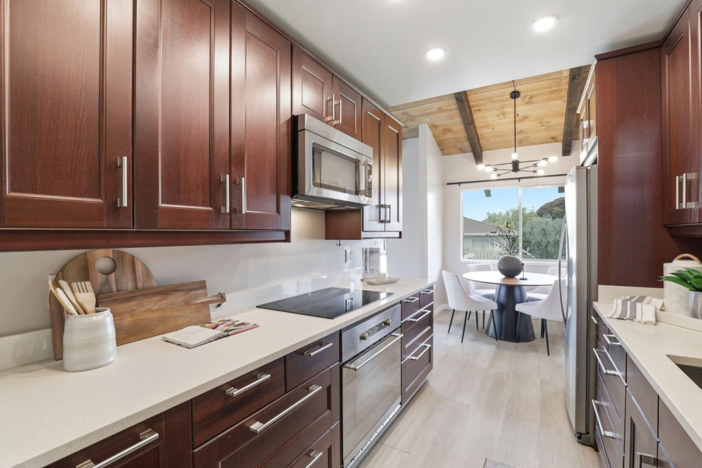 255 South Rengstorff Avenue, Unit 2 Mountain View, CA 94040 - Photo 9 of 25 a kitchen with a sink appliances and cabinets