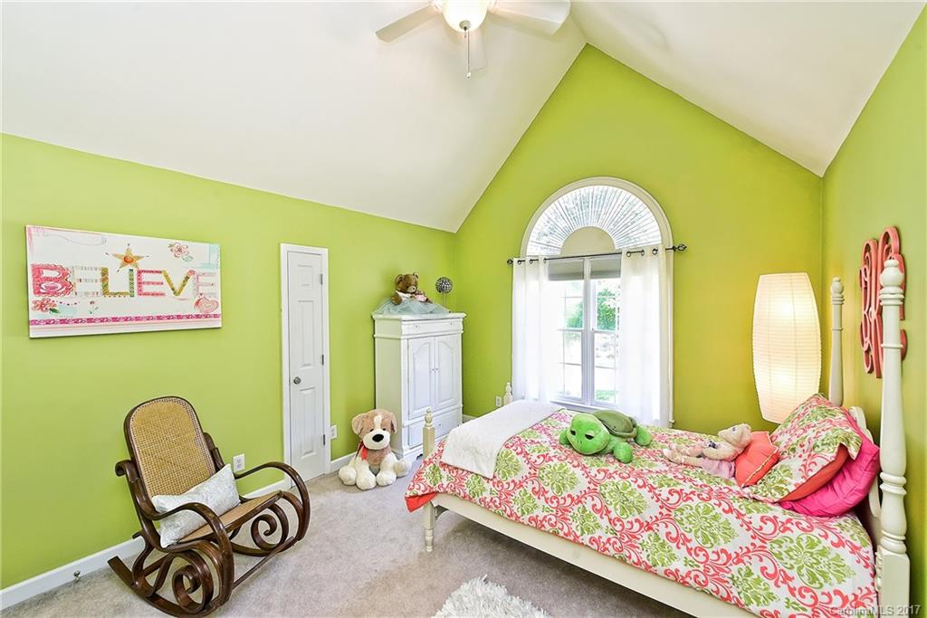 7098 Anchorage Lane Tega Cay, SC 29708 - Photo 14 of 23 a bedroom with a bed chair and a window