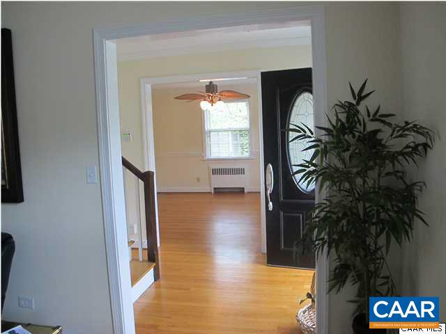 2103 Morris Road Charlottesville, VA 22903 - Photo 9 of 32 a view of a hallway with wooden floor and a potted plant